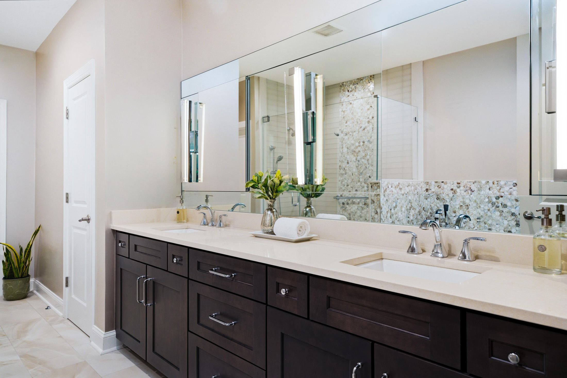 primary bathroom with soaking tub and dual vanities at 1 Aldrich Court