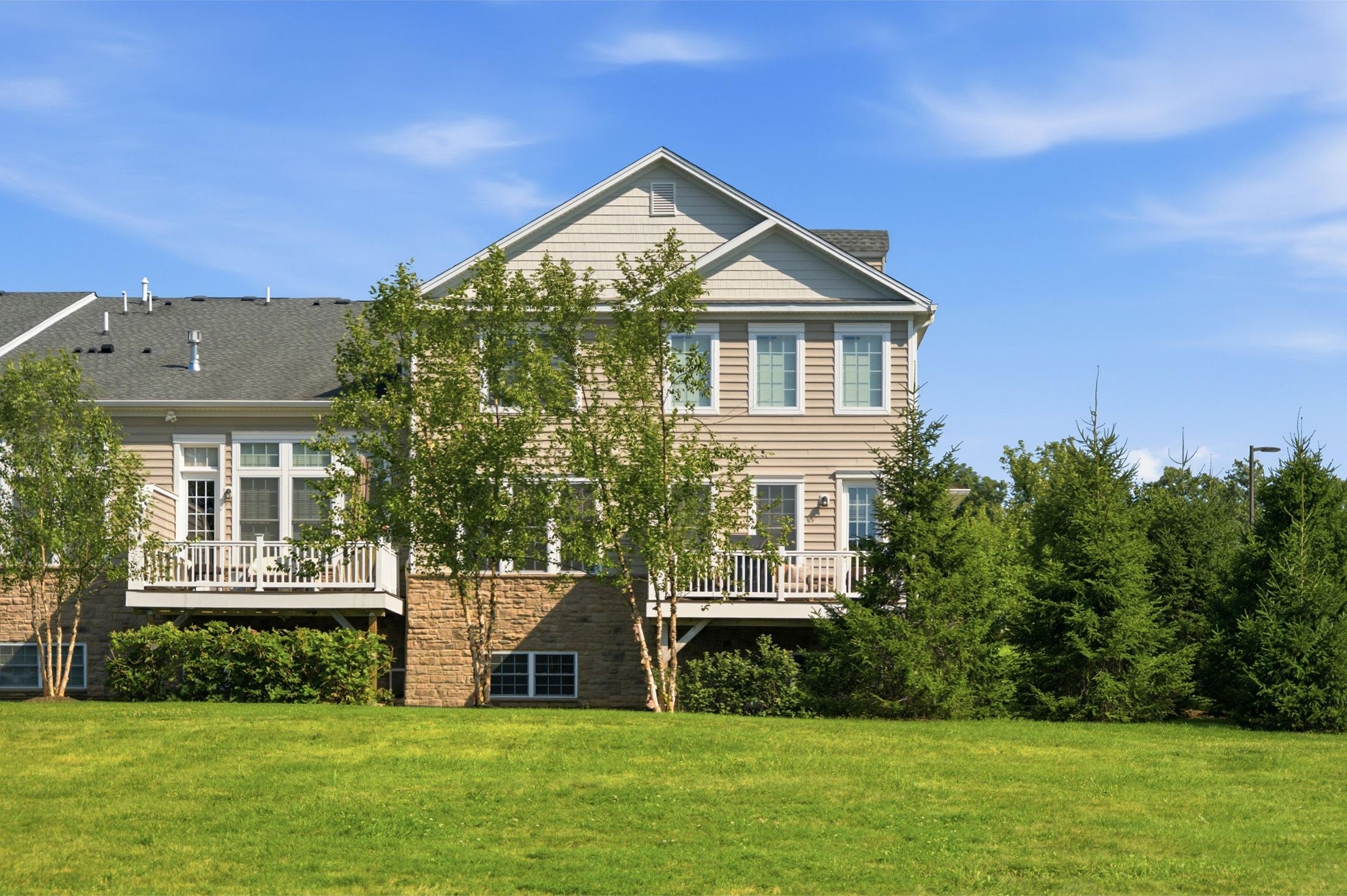 rear of home landscaped setting at 1 Aldrich Court